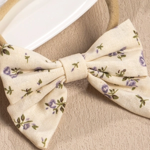 Floral bow baby headband with purple lavender print on soft nylon stretch band