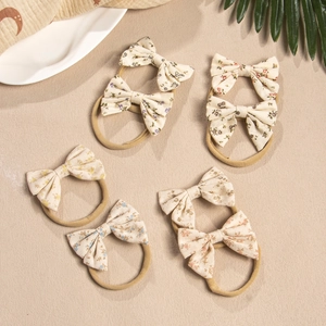Detailed set of 6 floral cotton bow headbands with soft nylon elastic bands for infants