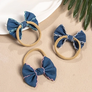 Three-piece set of baby bow headbands in vintage blue denim with colorful contrast stitching