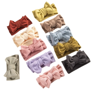 Set of 10 colorful waffle knit baby headbands with large double bows for infants
