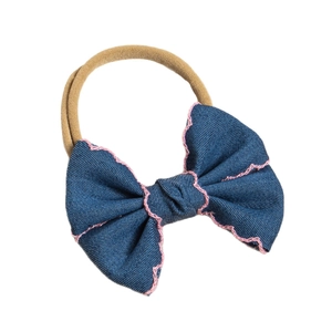 Blue denim baby headband with pink wavy stitching and soft nylon khaki elastic band