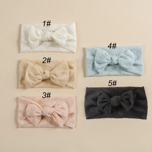Vue détaillée d'un lot de 5 bandeaux pour bébé avec nœuds en dentelle de diverses couleurs