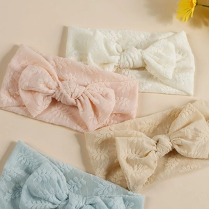 Lot de quatre bandeaux bébé en dentelle avec nœuds élégants aux couleurs pastel