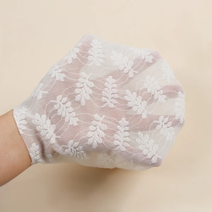 Breathable white floral lace baby hat with soft mesh fabric and lightweight texture