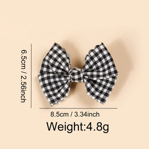 Detailed size view of pink gingham bow hair clip for babies showing 8.5cm width dimensions