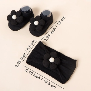 Detail showing dimensions of the black floral baby headbands and knit sock set