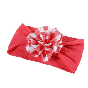 Elastic nylon baby headband in red with a large plaid floral decoration for newborns