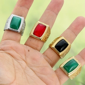 Men's vintage square signet ring with large gemstones and ornate relief patterns