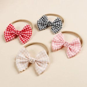 Detailed set of 4 gingham bow headbands for babies in red, black, pink, and beige