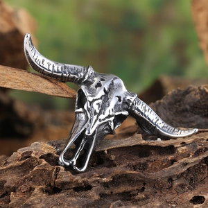 Vintage bison skull pendant in titanium steel with retro finish on natural wood base