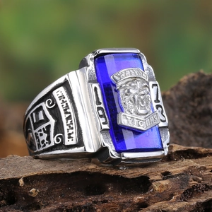 Macro detail of men's 1973 Tigers signet ring with blue gem and vintage engravings