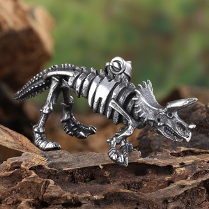 Macro shot of a vintage triceratops skeleton pendant on natural weathered wood