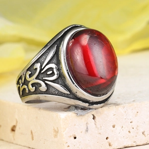 Vintage stainless steel ring with large oval red gemstone and retro floral engraving