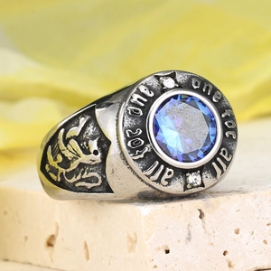 Macro shot of men's vintage signet ring with blue gemstone and lion crest detail