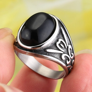 Vintage punk stainless steel ring with oval black gemstone and embossed floral patterns