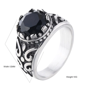 Minimalist stainless steel ring for men featuring a large round black gemstone and carving