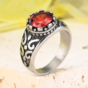 Vintage stainless steel ring with oval red gemstone and intricate floral carvings