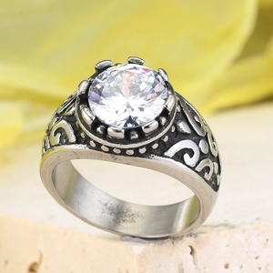 Retro stainless steel ring featuring a large round clear stone and ornate carvings
