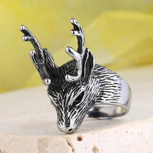 Vintage stainless steel ring featuring a detailed ram head design with an oxidized finish