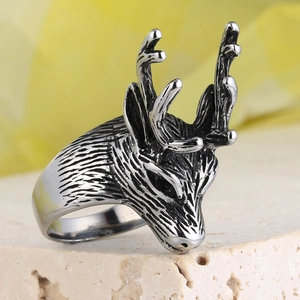 Vintage punk goat head pendant in stainless steel with oxidized finish on stone base