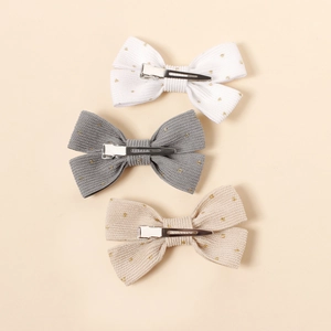 Lot de trois barrettes nœuds en velours côtelé avec étoiles dorées en blanc gris et beige