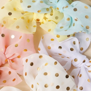 Polka dot mesh bow headbands for infants in yellow, pink, white, and light blue colors
