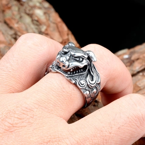 Macro detail of retro bull head ring showing intricate carvings on vintage steel