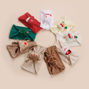 Vue détaillée de neuf bandeaux bébé en nylon élastique avec des icônes de Noël en peluche