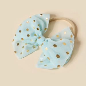 Detail of light blue mesh baby headband with gold polka dots and elastic nylon band