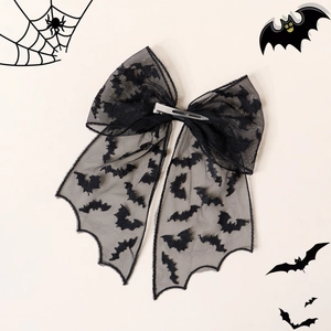 Detail of black Halloween bat lace bow hair clip with silver metal alligator clip back