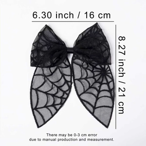 Detail view of large black lace spider web bow showing 16cm width dimensions