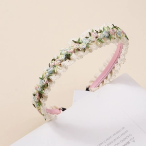 Broderie détaillée de fleurs colorées sur un serre-tête en dentelle beige pour filles