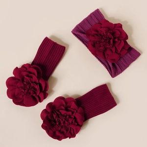 Détails de trois bandeaux pour bébé en maille côtelée avec grandes fleurs en tissu