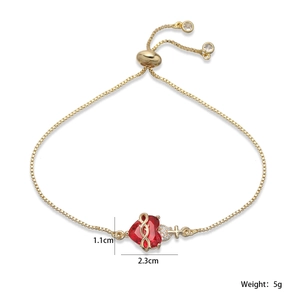 Bracelet ajustable plaqué or avec pierre de cœur rouge et breloque croix en cristal