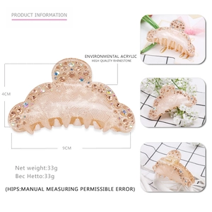 Large nude acrylic shark hair claw clip with rhinestones and floral decoration
