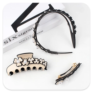 Close-up of beige acetate flower hair claw and pearl headband set for women accessories