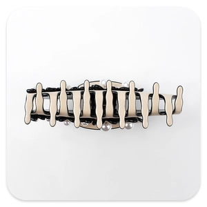 Detail of beige and black flower claw clip featuring fluid melting design and faux pearls