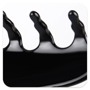 Macro view of wave-shaped teeth on a glossy black acetate flower hair claw clip