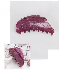 Detail of a 12.2cm purple acrylic hair claw clip with rhinestones and precise dimensions