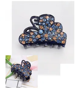 Detail showing deep blue acrylic butterfly hair claw clip with rhinestones and dimensions