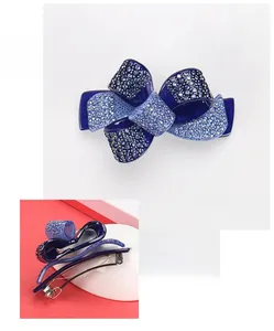 Detailed view of dark blue acrylic bow hair clip with crystal rhinestones and size data