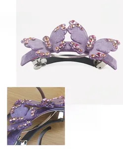 Detailed macro view of Czech crystal double butterfly hair clip with purple acrylic base
