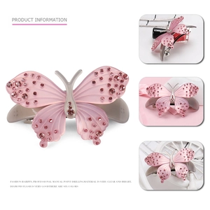 Pink acetate butterfly hair clip with sparkling rhinestones and elegant spring fastener