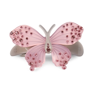 Detailed view of pink acetate butterfly hair clip with sparkling rhinestones and spring clamp