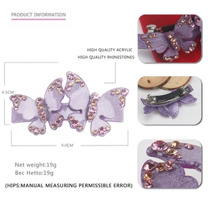Detail view of purple double butterfly hair clip with sparkling acrylic rhinestones