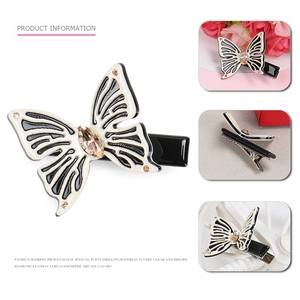 Elegante fermaglio per capelli a farfalla in acetato con strass e base a becco d'anatra