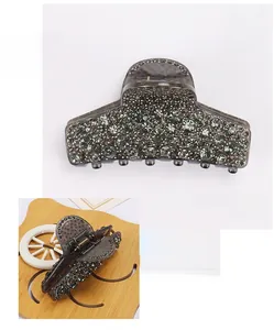 Macro view of crystal rhinestone claw clip with dimensions 8.5x5.5cm and metallic spring