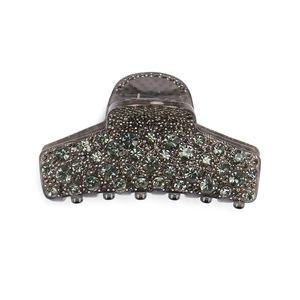 Close-up of rectangular hair claw clip with dark grey resin and pavé rhinestones