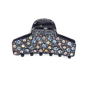 Macro detail of rectangle hair claw clip with colorful rhinestones and black acrylic base