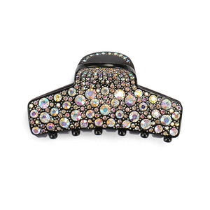 Close-up of black acrylic hair claw with multi-colored rhinestones and shimmering crystals